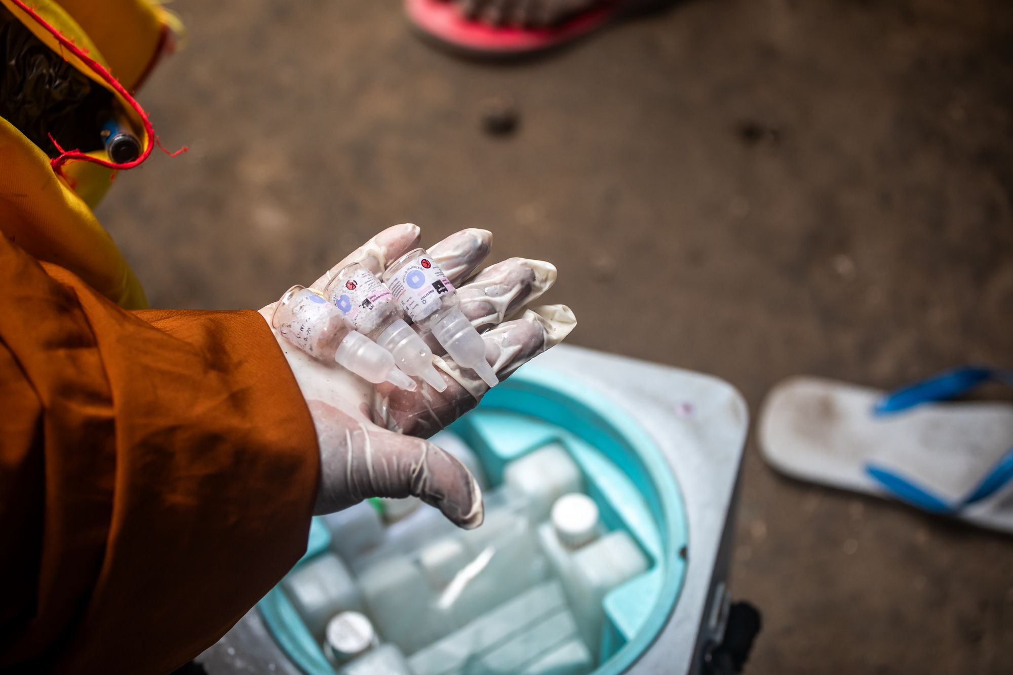 A community health worker hold vials of the oral polio vaccination (nOPV2) during a door-to-door polio immunization campaign in the Hamar Jajab district, in Mogadishu, Somalia, on May 29, 2023.